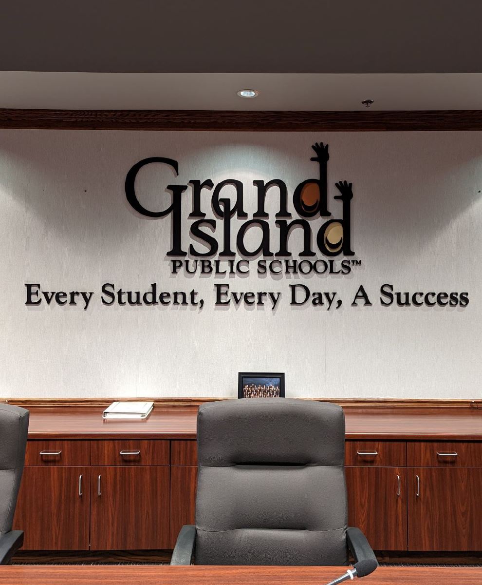  Photo of GIPS logo and slogan on wall of board room
